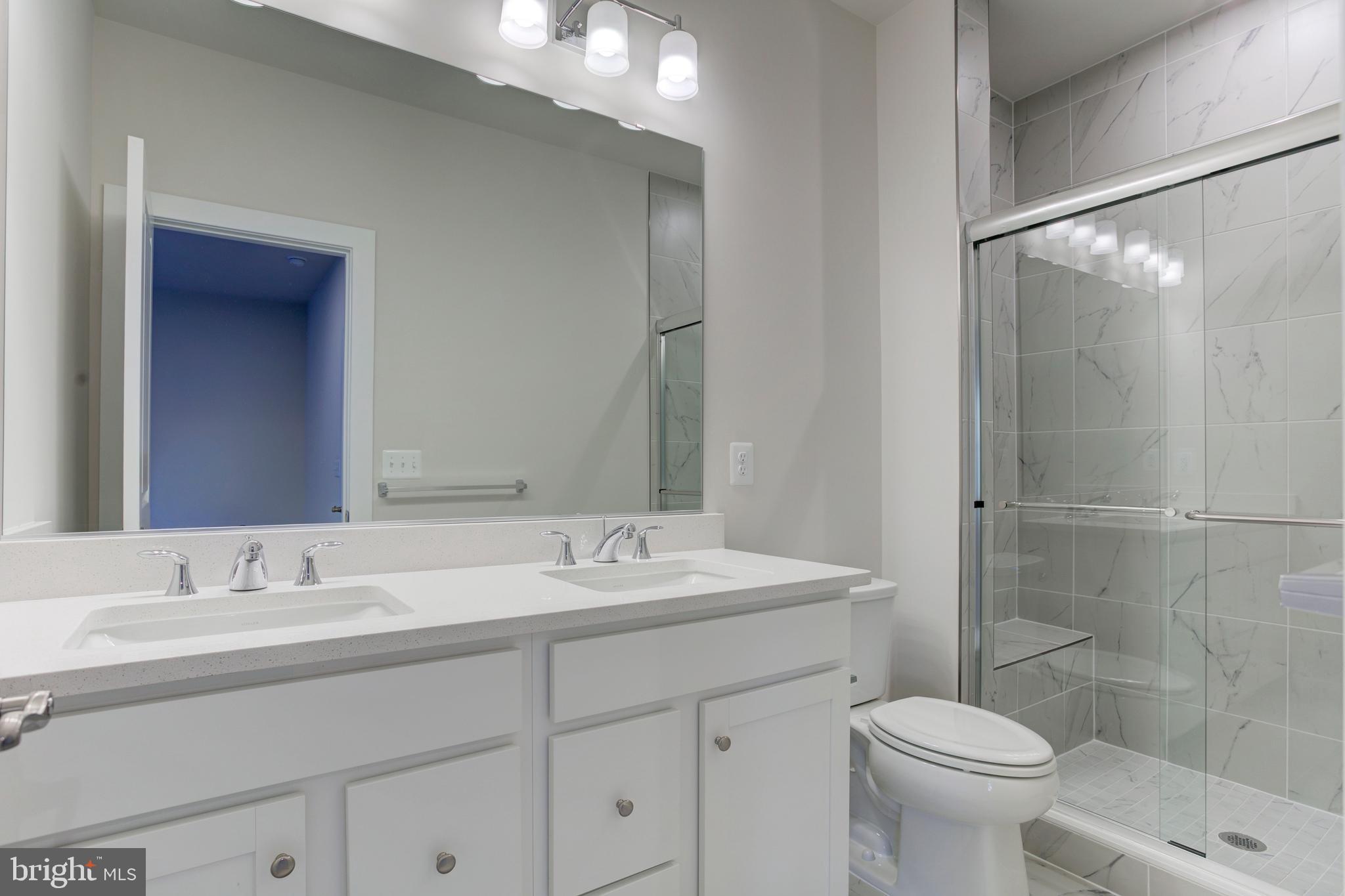 13172 Arches Road Herndon, VA 20170 - Photo 22 of 31 a bathroom with a sink toilet and shower