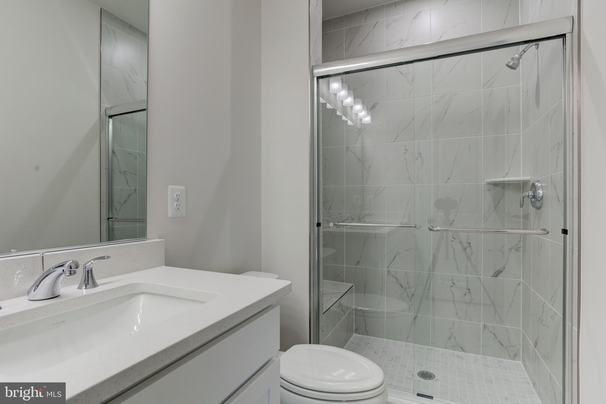 13172 Arches Road Herndon, VA 20170 - Photo 23 of 31 a bathroom with a sink toilet and shower