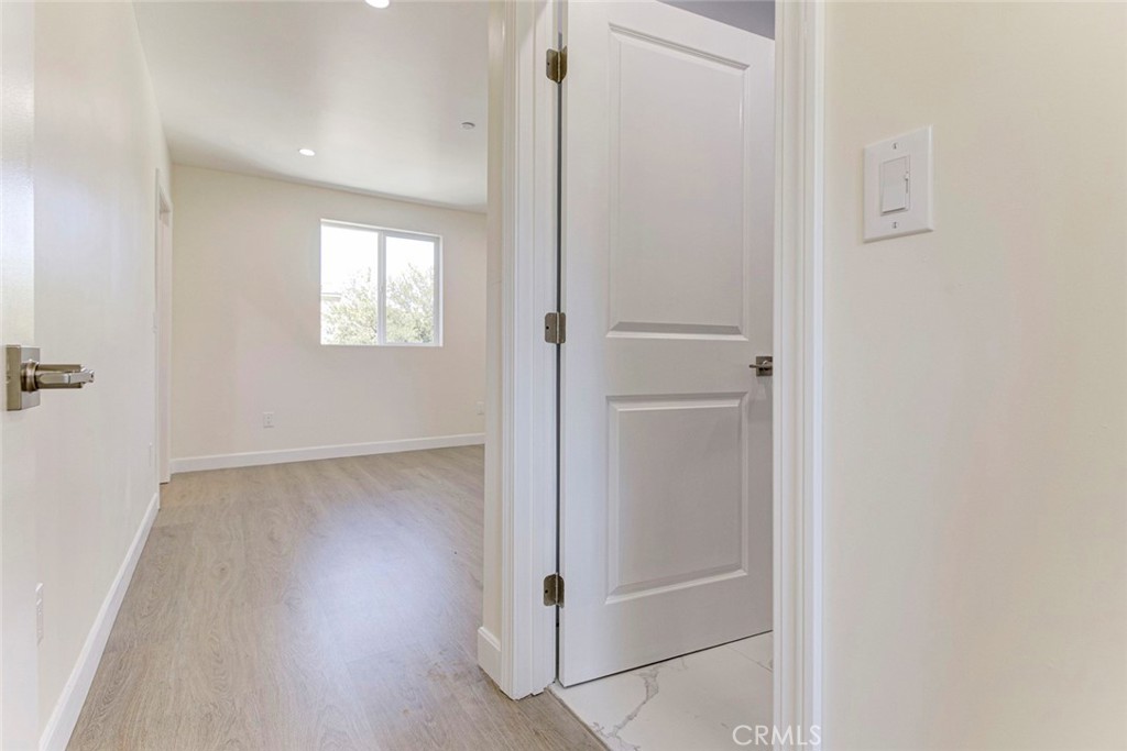 7044-2 Greeley Street Tujunga, CA 91042 - Photo 11 of 20 a view of a hallway with wooden floor