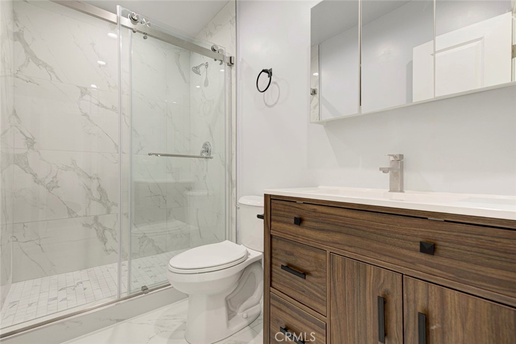 7044-2 Greeley Street Tujunga, CA 91042 - Photo 12 of 20 a bathroom with a shower a toilet and sink