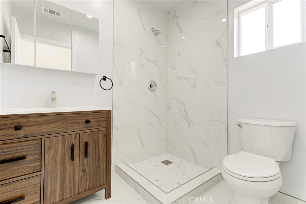 7044-2 Greeley Street Tujunga, CA 91042 - Photo 17 of 20 a bathroom with a shower a toilet and sink