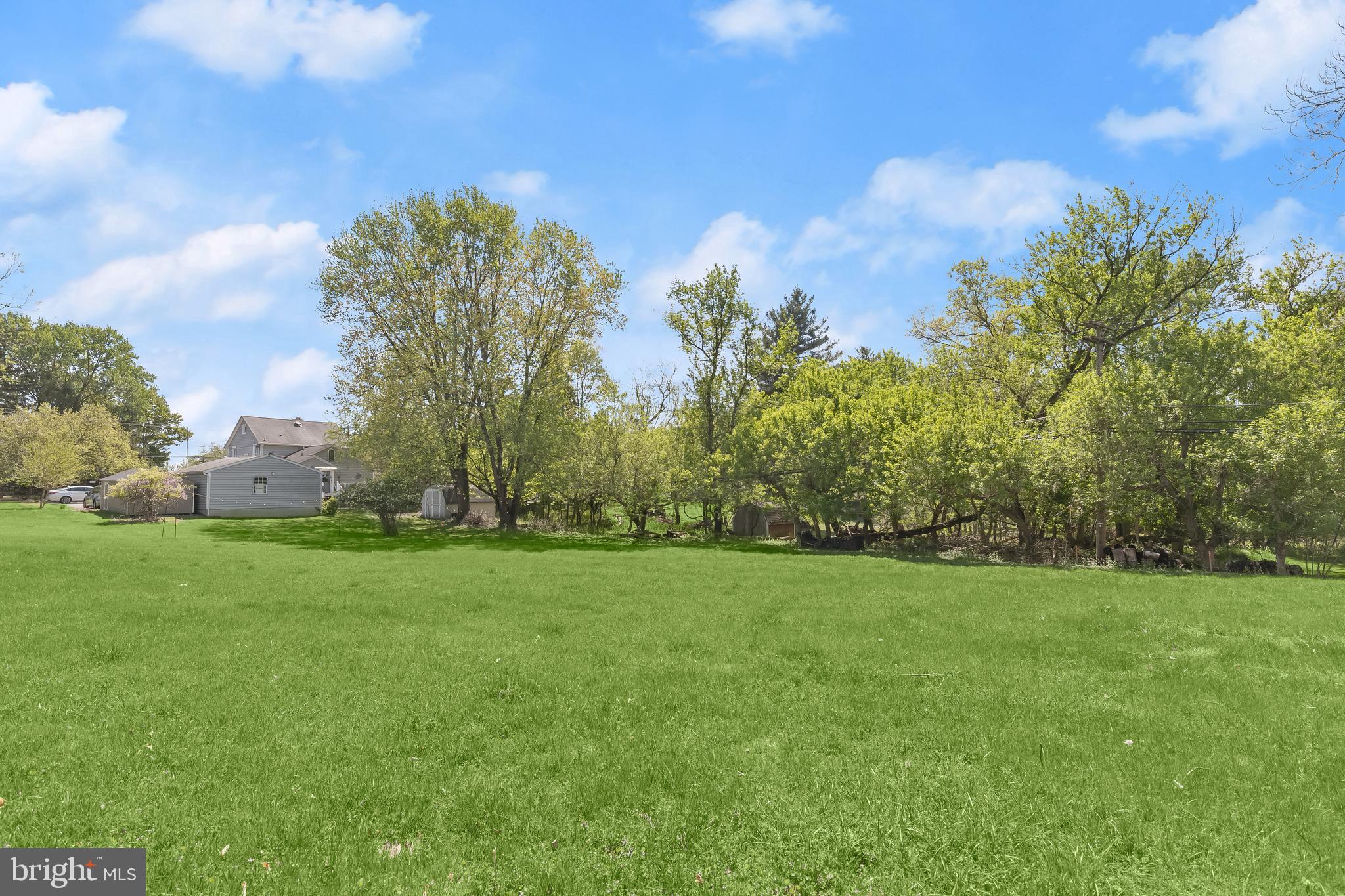 9100 Whitehall Road Ellicott City, MD 21042 - Photo 8 of 13 a view of a field of grass and trees