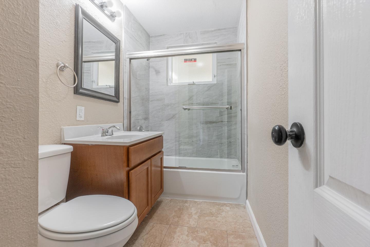 3490 Royal Road Concord, CA 94519 - Photo 13 of 17 a bathroom with a toilet a sink and shower