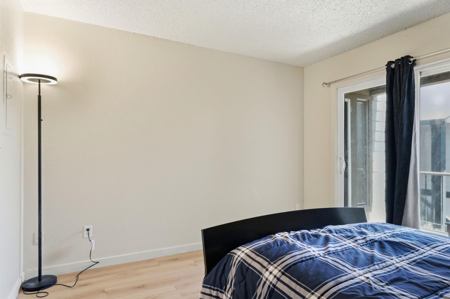 7283 Florin Road, Unit 8 Sacramento, CA 95828 - Photo 23 of 35 a bedroom with a bed and a window