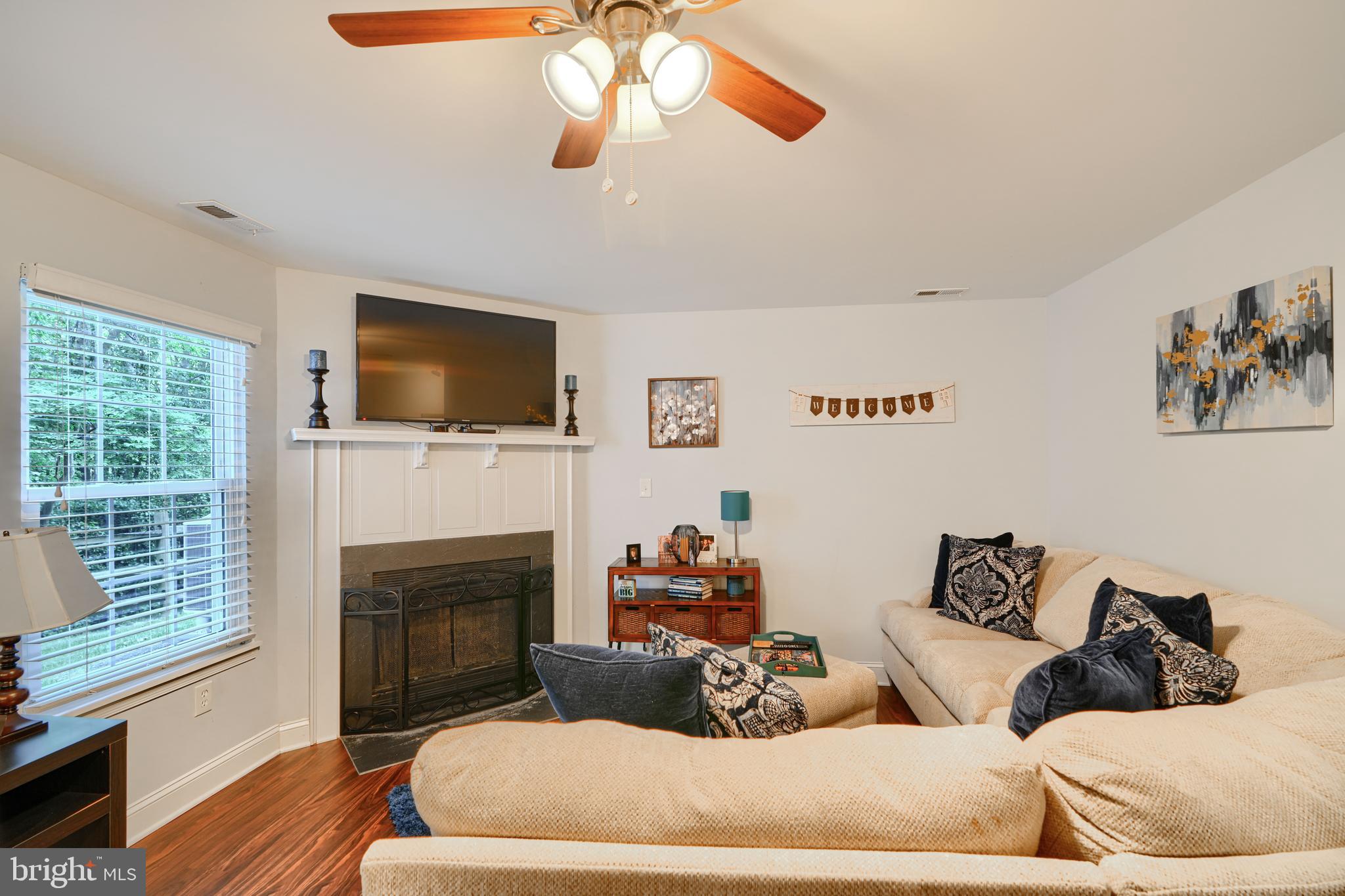 40 Surrey Lane, Unit 122 Nottingham, MD 21236 - Photo 13 of 31 a living room with furniture fireplace and flat screen tv