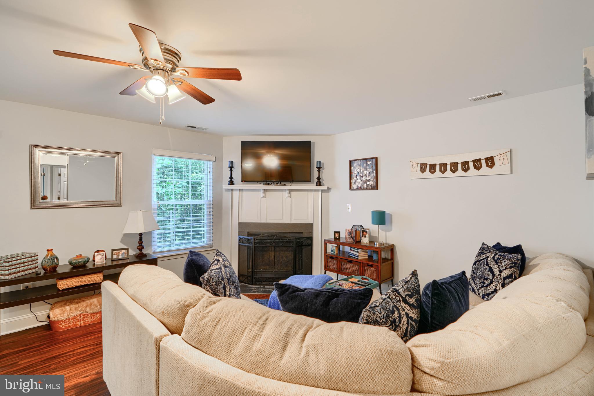 40 Surrey Lane, Unit 122 Nottingham, MD 21236 - Photo 14 of 31 a living room with furniture fireplace and a flat screen tv
