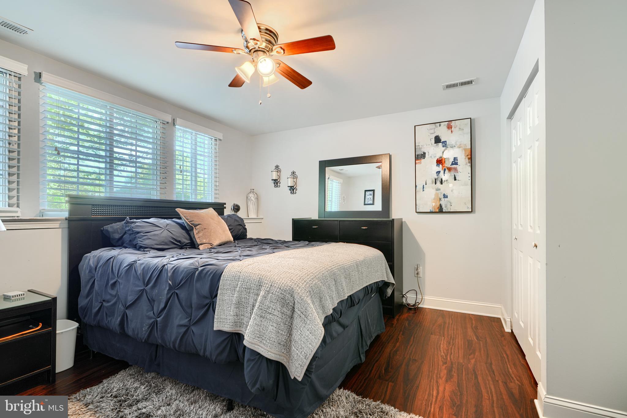 40 Surrey Lane, Unit 122 Nottingham, MD 21236 - Photo 24 of 31 a bed room with a bed and a chandelier