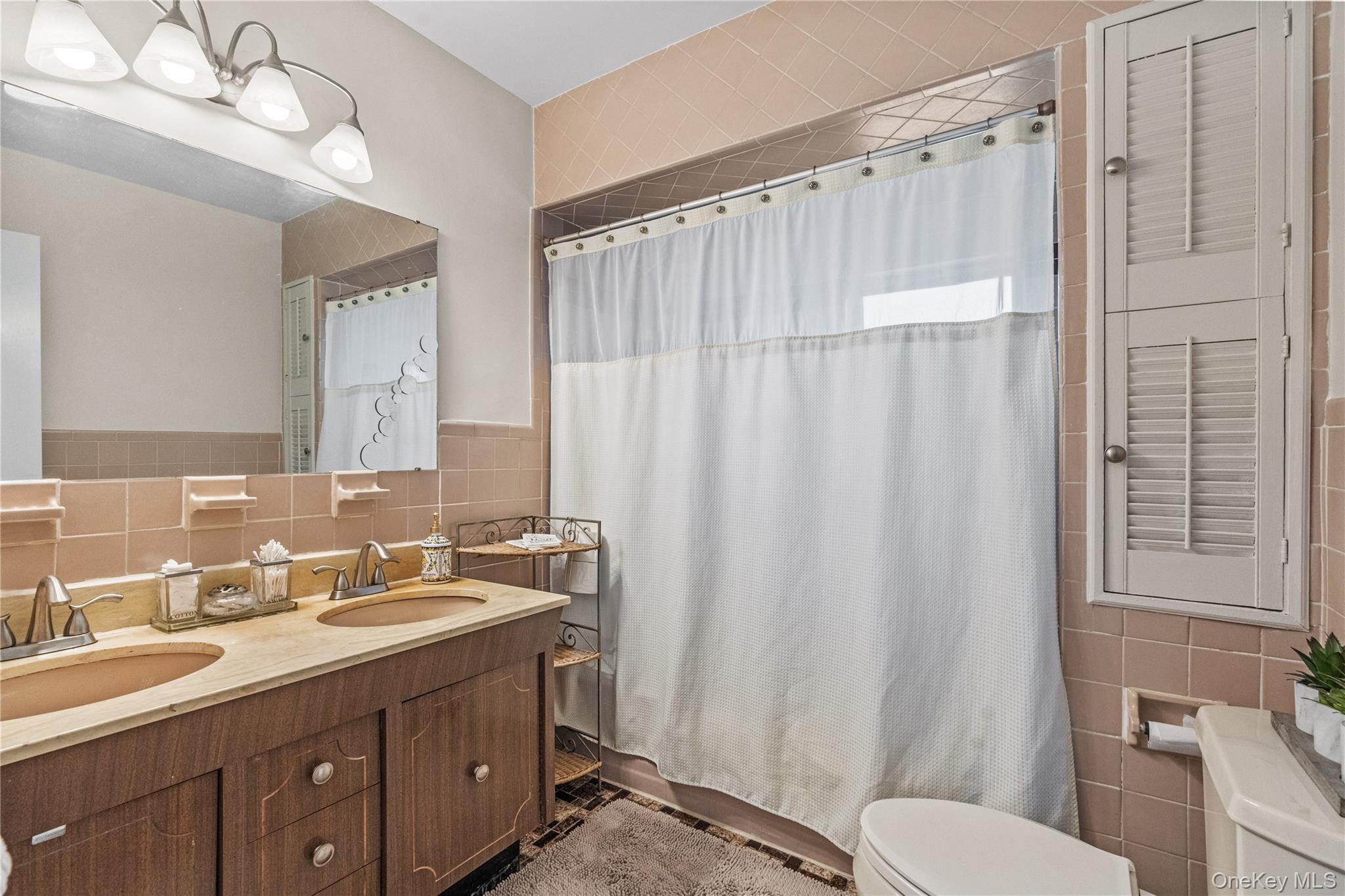 35 Lispenard Avenue New Rochelle, NY 10801 - Photo 23 of 37 a bathroom with a double vanity sink mirror and toilet