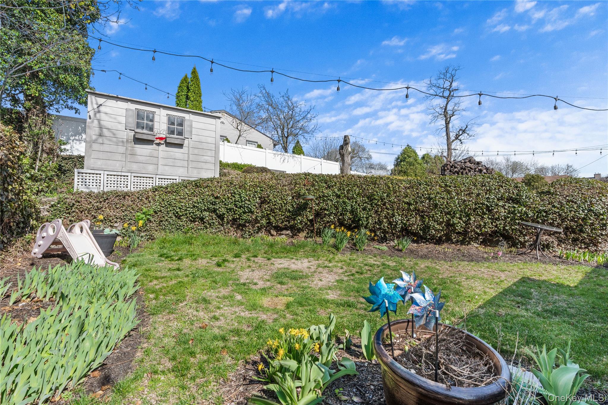 35 Lispenard Avenue New Rochelle, NY 10801 - Photo 29 of 37 a front view of a house with a yard