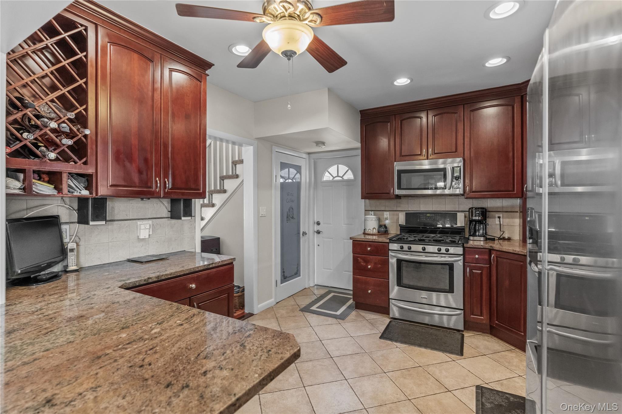 35 Lispenard Avenue New Rochelle, NY 10801 - Photo 3 of 37 a kitchen with stainless steel appliances granite countertop a stove top oven a sink and dishwasher