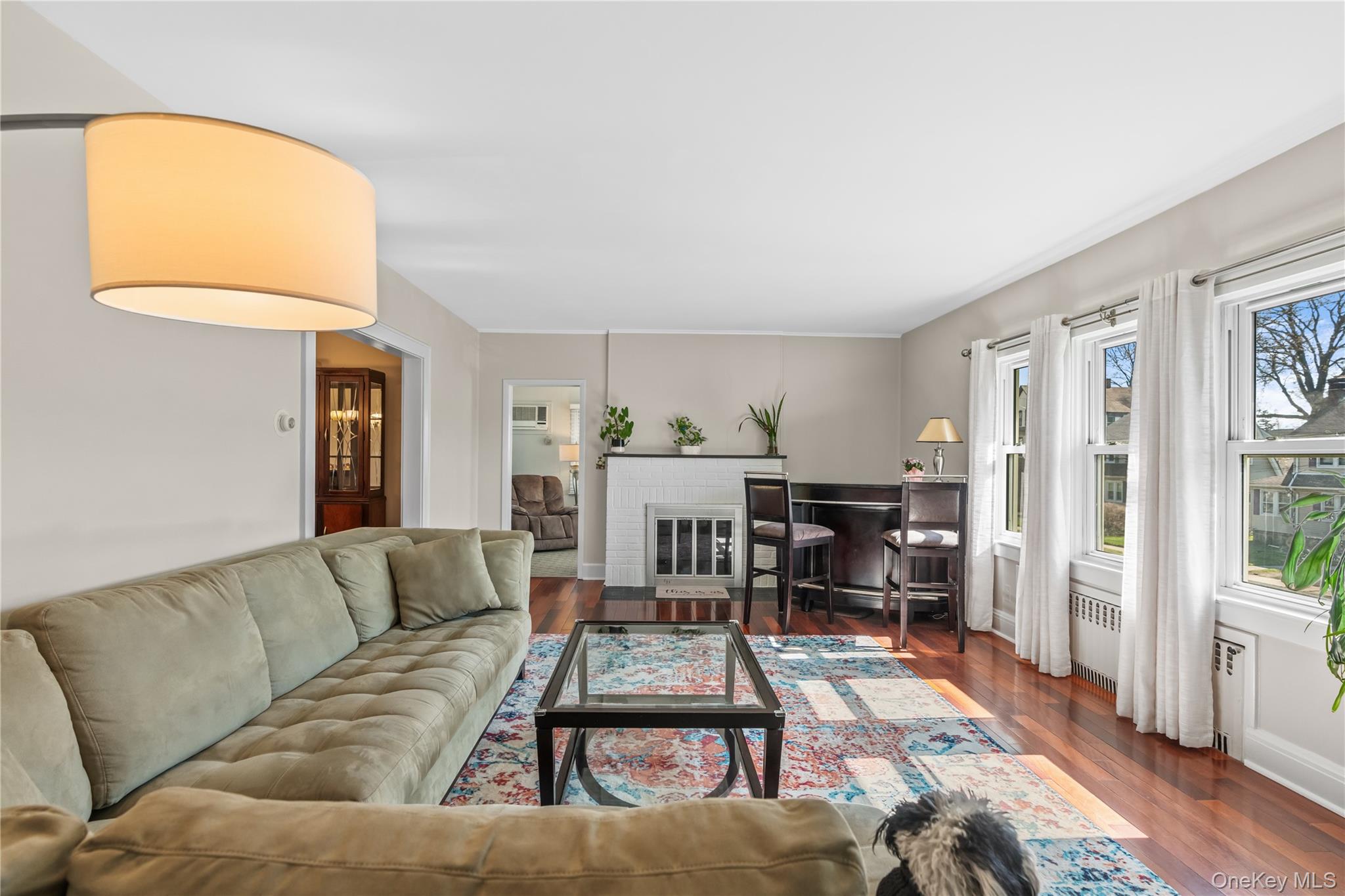 35 Lispenard Avenue New Rochelle, NY 10801 - Photo 9 of 37 a living room with furniture and a fireplace