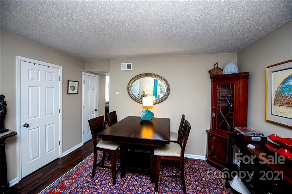 1911 Smoke Ridge Court Charlotte, NC 28210 - Photo 8 of 15 a view of a dining room with furniture and wooden floor
