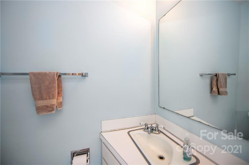 1911 Smoke Ridge Court Charlotte, NC 28210 - Photo 10 of 15 a bathroom with a sink and a mirror