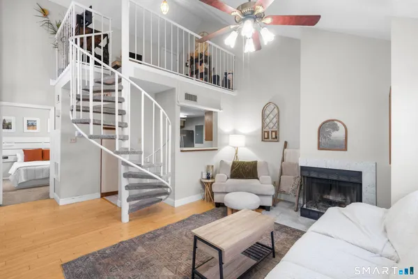 a living room with furniture and a fireplace