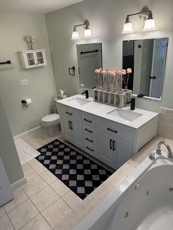 45 Crescent Road, Unit 45 Needham, MA 02494 - Photo 8 of 25 a bathroom with a double vanity sink mirror and toilet