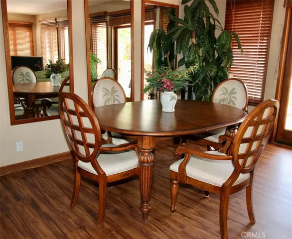 a view of a dining room with furniture and window