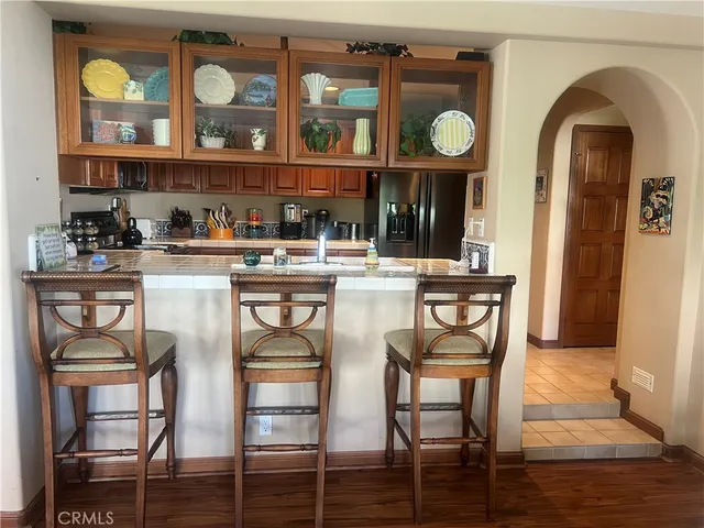 a dining table with chairs and wooden floor