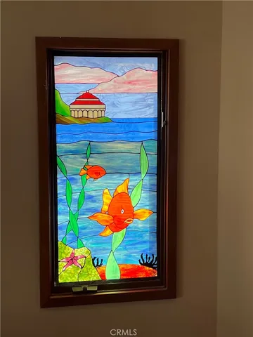 a bedroom with furniture and a chandelier