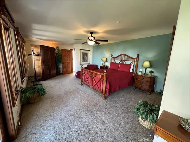 a living room with furniture and a lamp