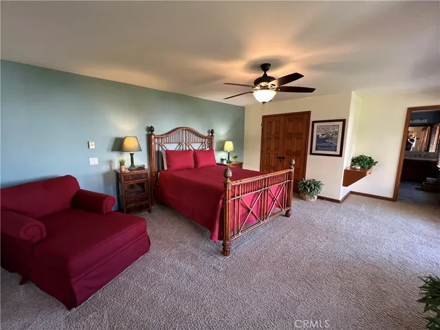 a bath room with a bathtub and a double vanity sink