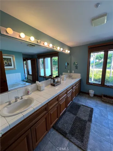 a view of a swimming pool with a lounge chairs