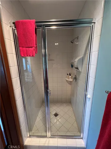 a view of a swimming pool and lounge chairs