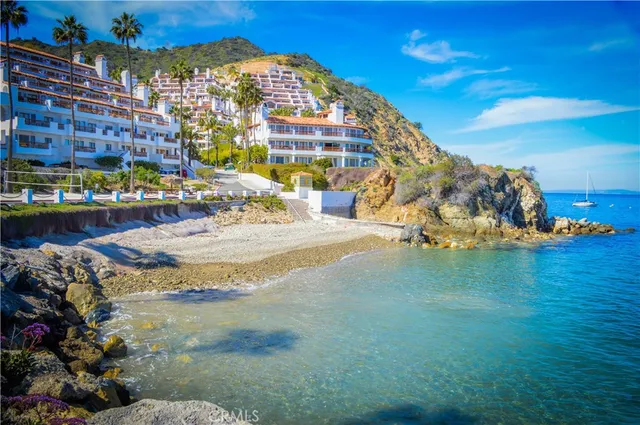 a backyard of a house with lots of green space and outdoor seating