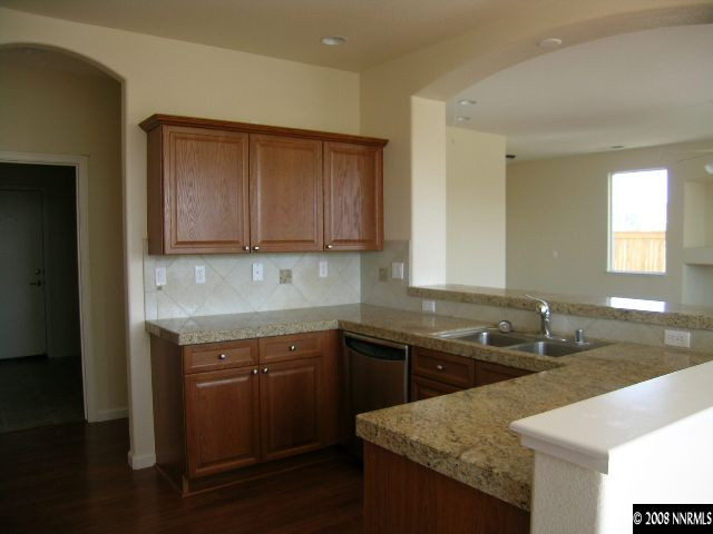 1705 Canyon Shadow Circle Reno, NV 89521 - Photo 2 of 8 a kitchen with a sink and cabinets