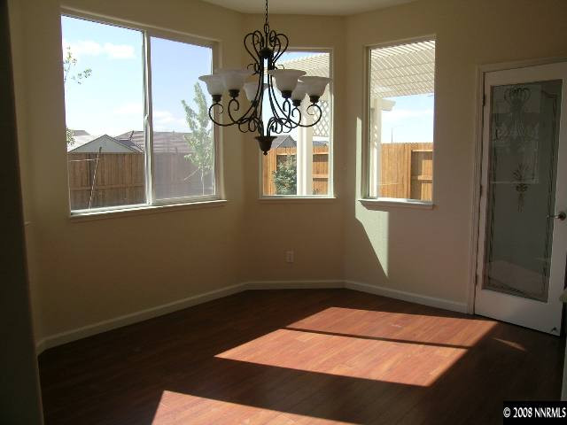 1705 Canyon Shadow Circle Reno, NV 89521 - Photo 4 of 8 a view of wooden floor in a room next to a window