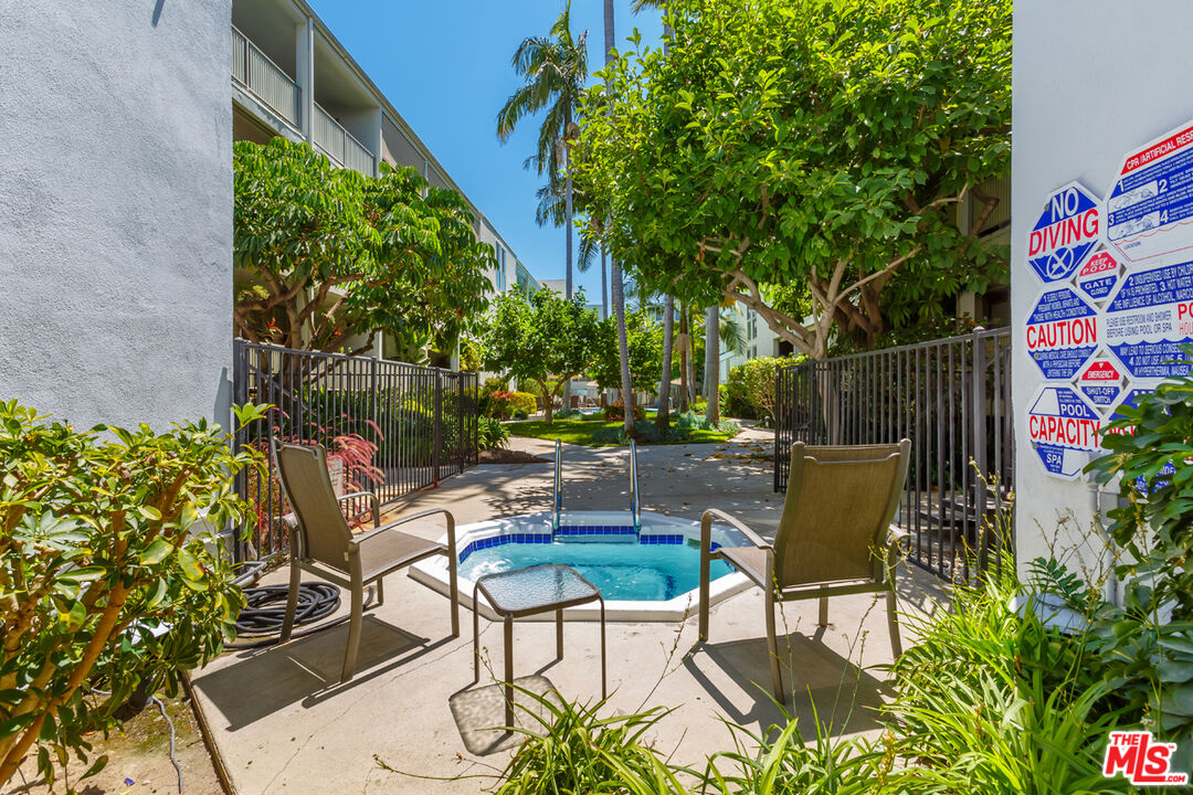 848 North Kings Road, Unit 208 West Hollywood, CA 90069 - Photo 28 of 30 a view of backyard with seating and green space