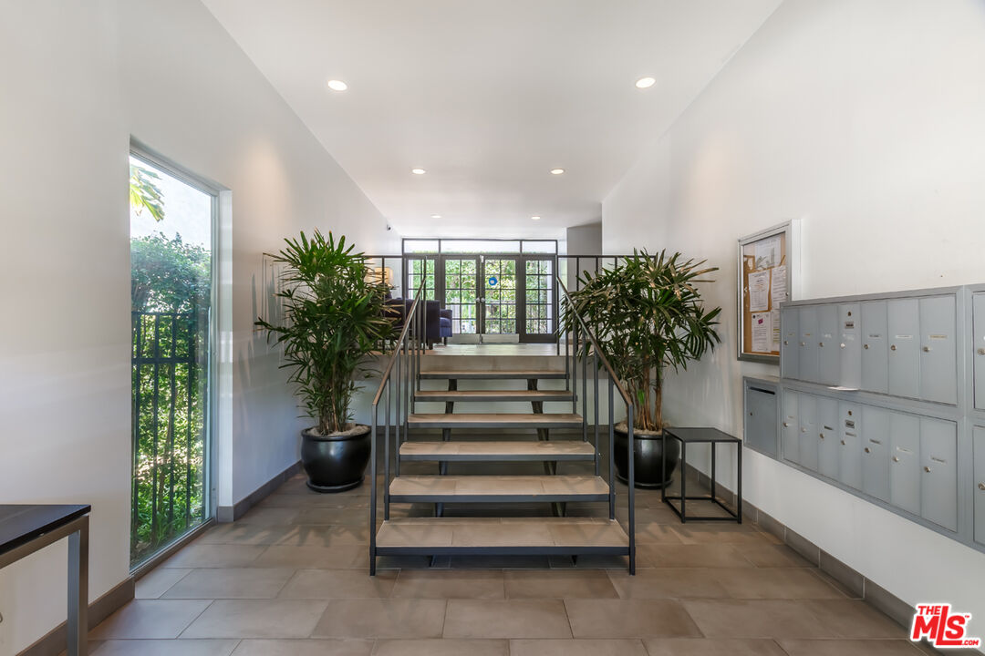 848 North Kings Road, Unit 208 West Hollywood, CA 90069 - Photo 29 of 30 a view of entryway with stairs and a potted plant