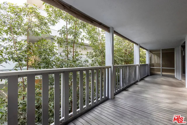 a view of backyard with seating and green space