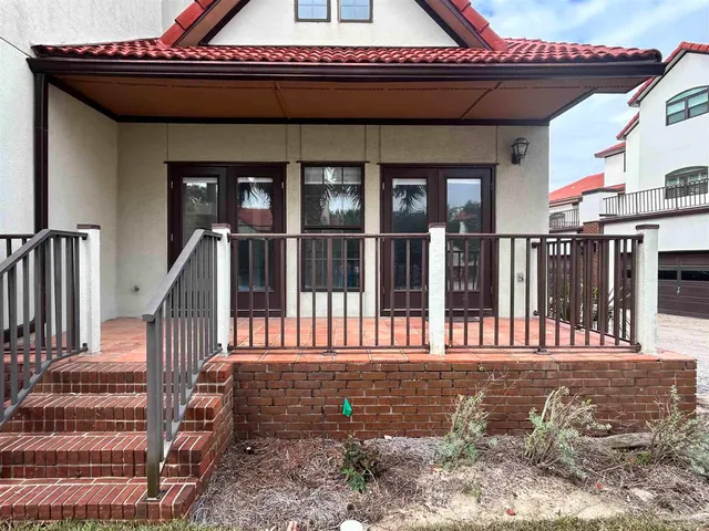 a view of a balcony with furniture