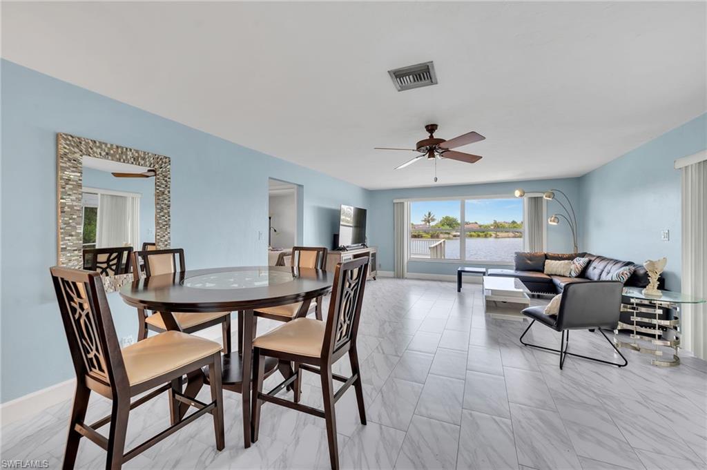 3065 50th Lane Southwest Naples, FL 34116 - Photo 10 of 31 a view of a livingroom and dining room