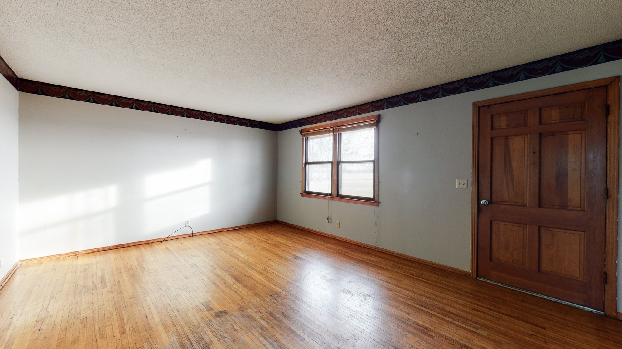 5078 Boyd Holland Road Springfield, TN 37172 - Photo 41 of 46 an empty room with wooden floor and windows