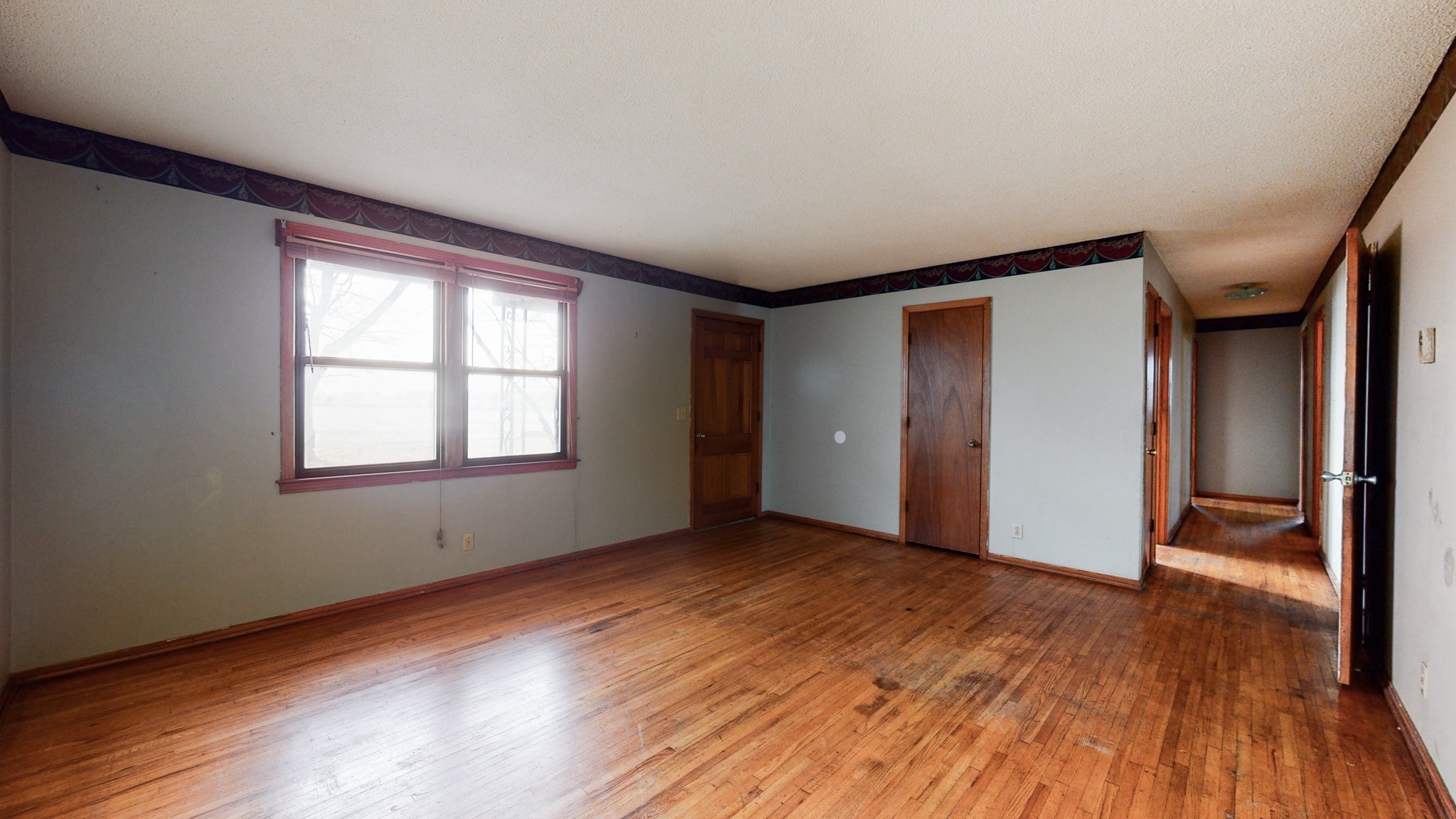 5078 Boyd Holland Road Springfield, TN 37172 - Photo 42 of 46 a view of an empty room with wooden floor and a window