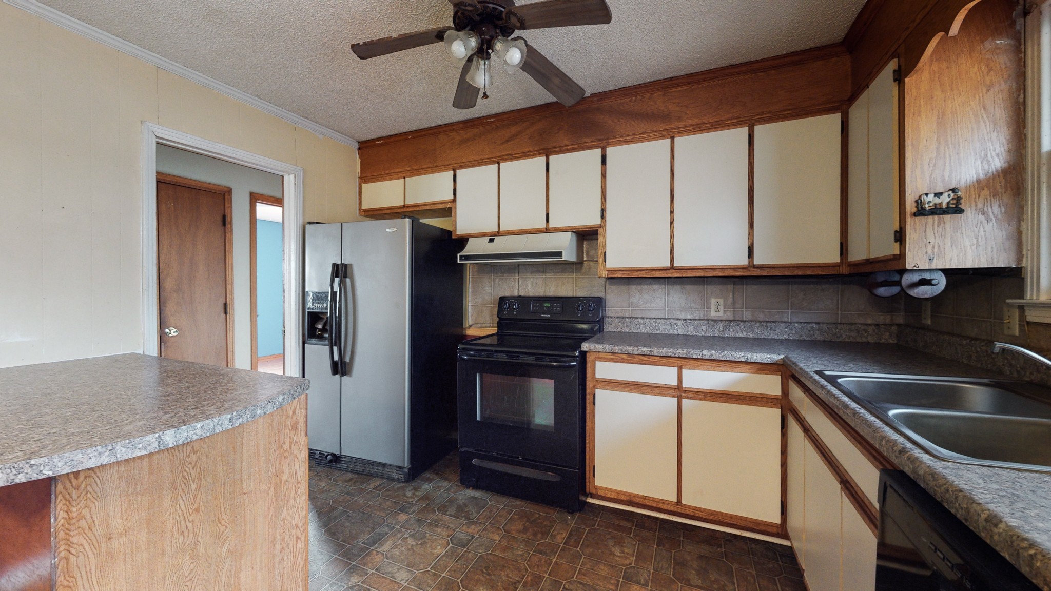 5078 Boyd Holland Road Springfield, TN 37172 - Photo 43 of 46 a kitchen with stainless steel appliances granite countertop a sink a stove and refrigerator