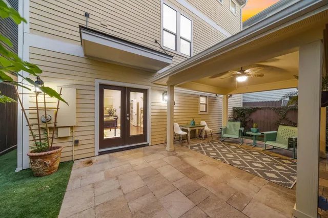 a living room with furniture and view of kitchen