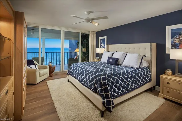 a large bedroom with a bed and window