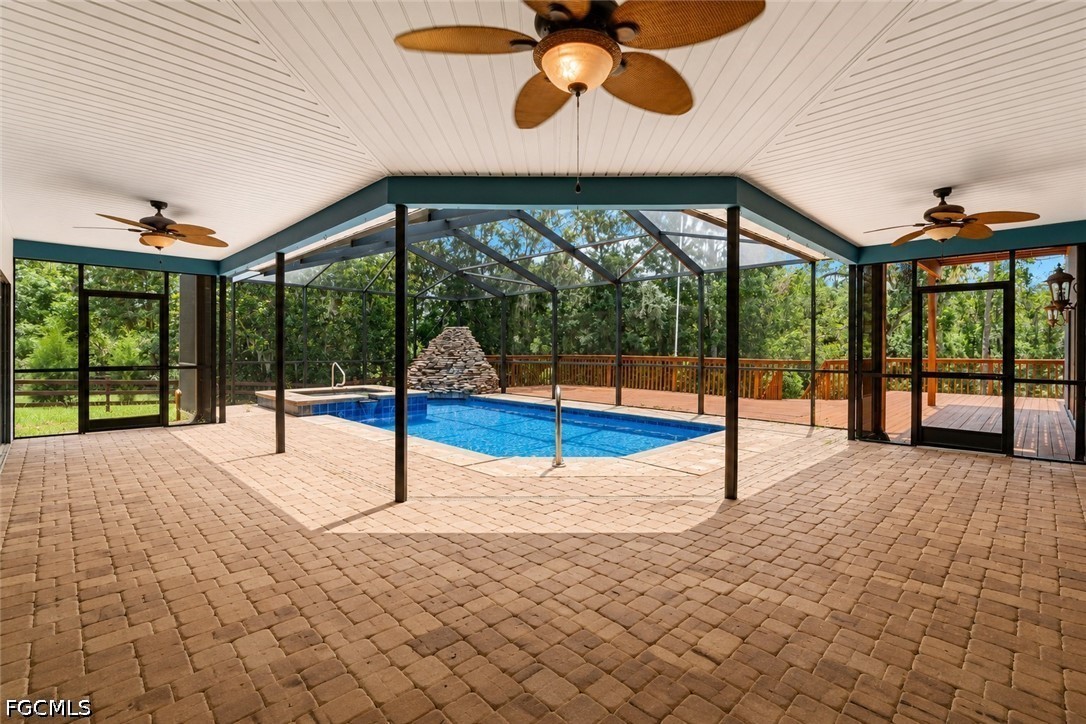 27255 Hickory Hill Road Brooksville, FL 34602 - Photo 16 of 50 a view of an empty room with a sliding door