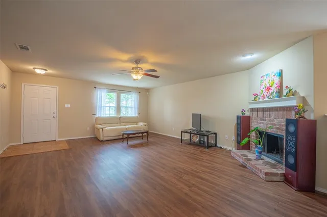 a view of livingroom with furniture and a fireplace
