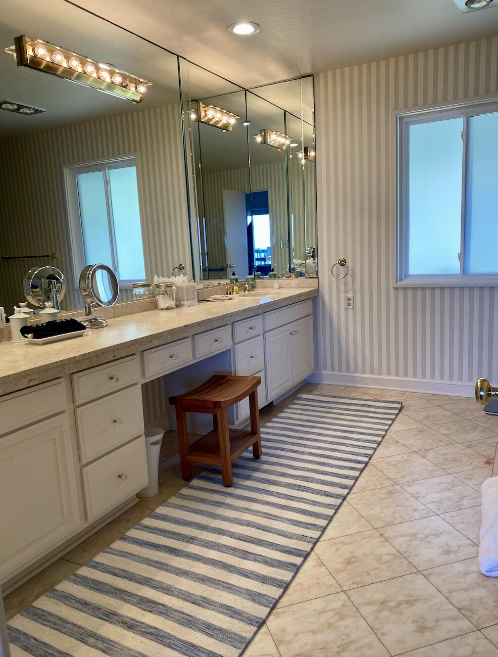 174 Coronada Circle Santa Barbara, CA 93108 - Photo 18 of 33 a large bathroom with a sink a large mirror and a shower