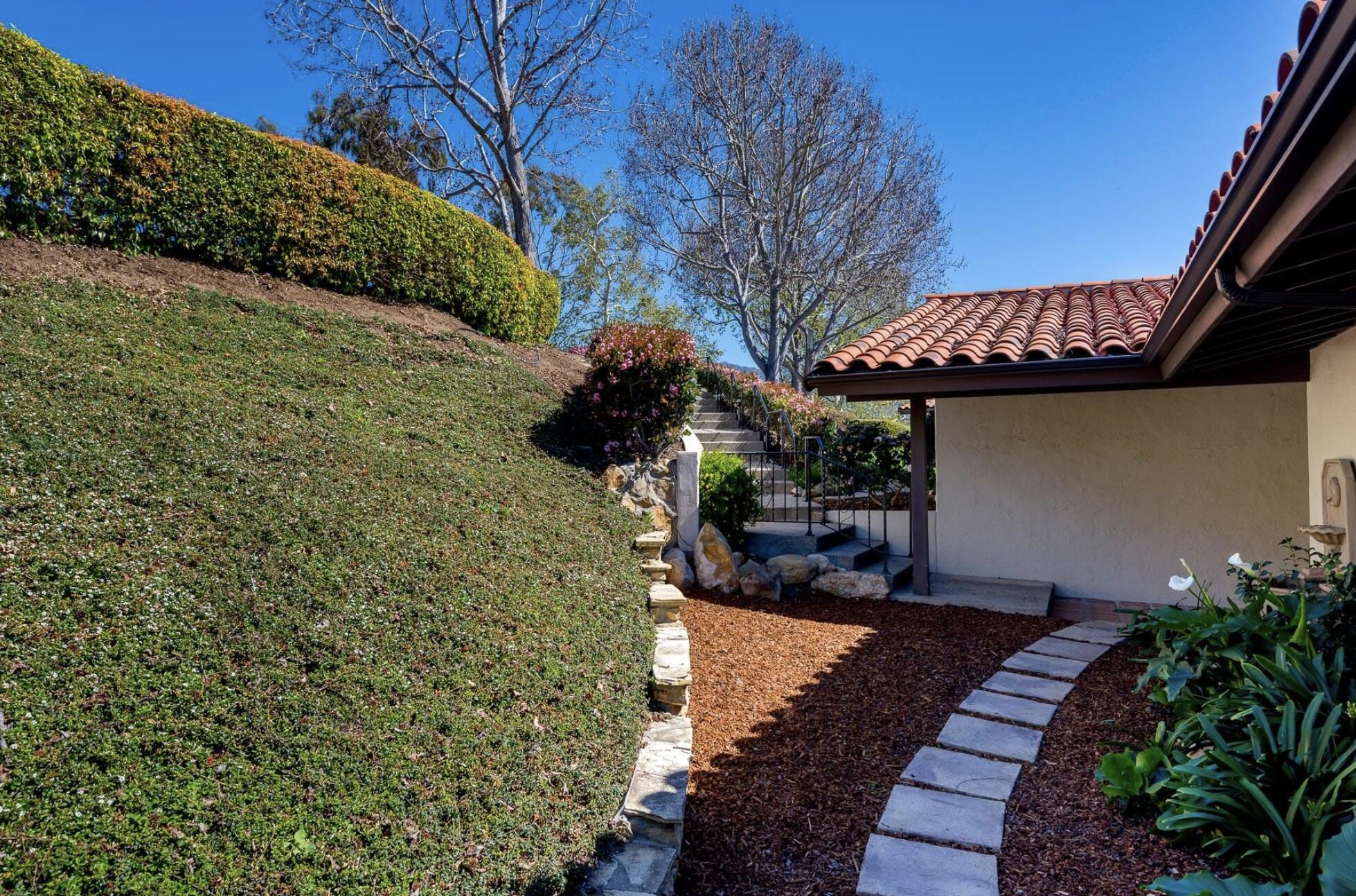 174 Coronada Circle Santa Barbara, CA 93108 - Photo 27 of 33 a view of a patio with table and chairs with wooden floor and plants