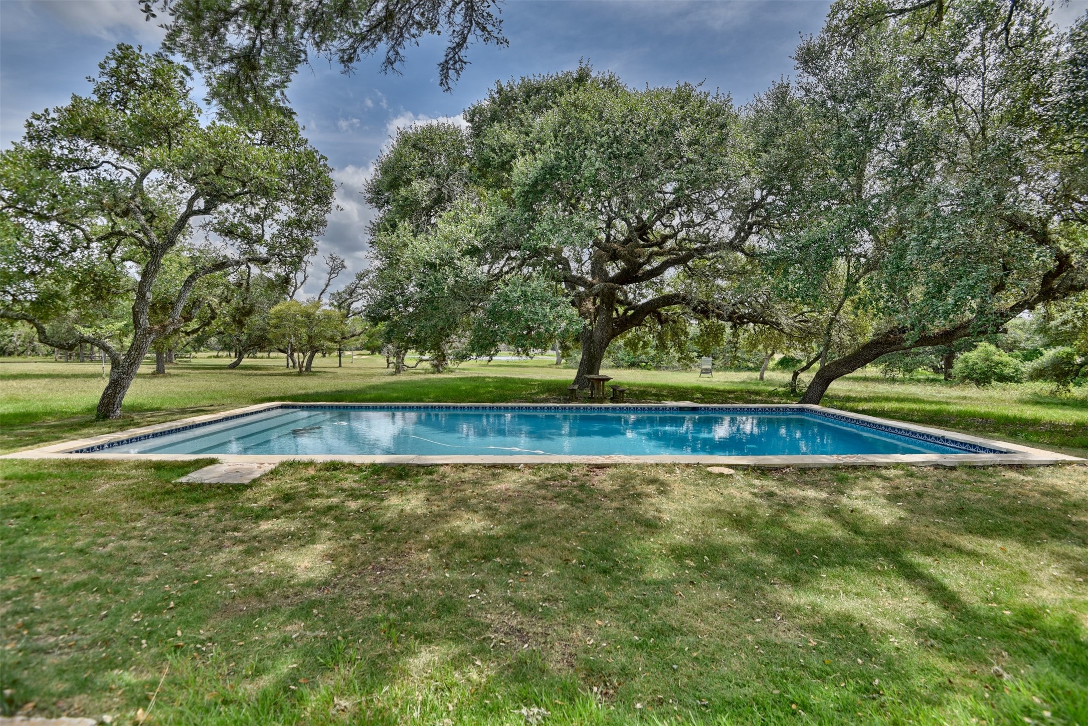 2003 Oak Ridge Road Weimar, TX 78962 - Photo 17 of 35 a view of a swimming pool with a yard