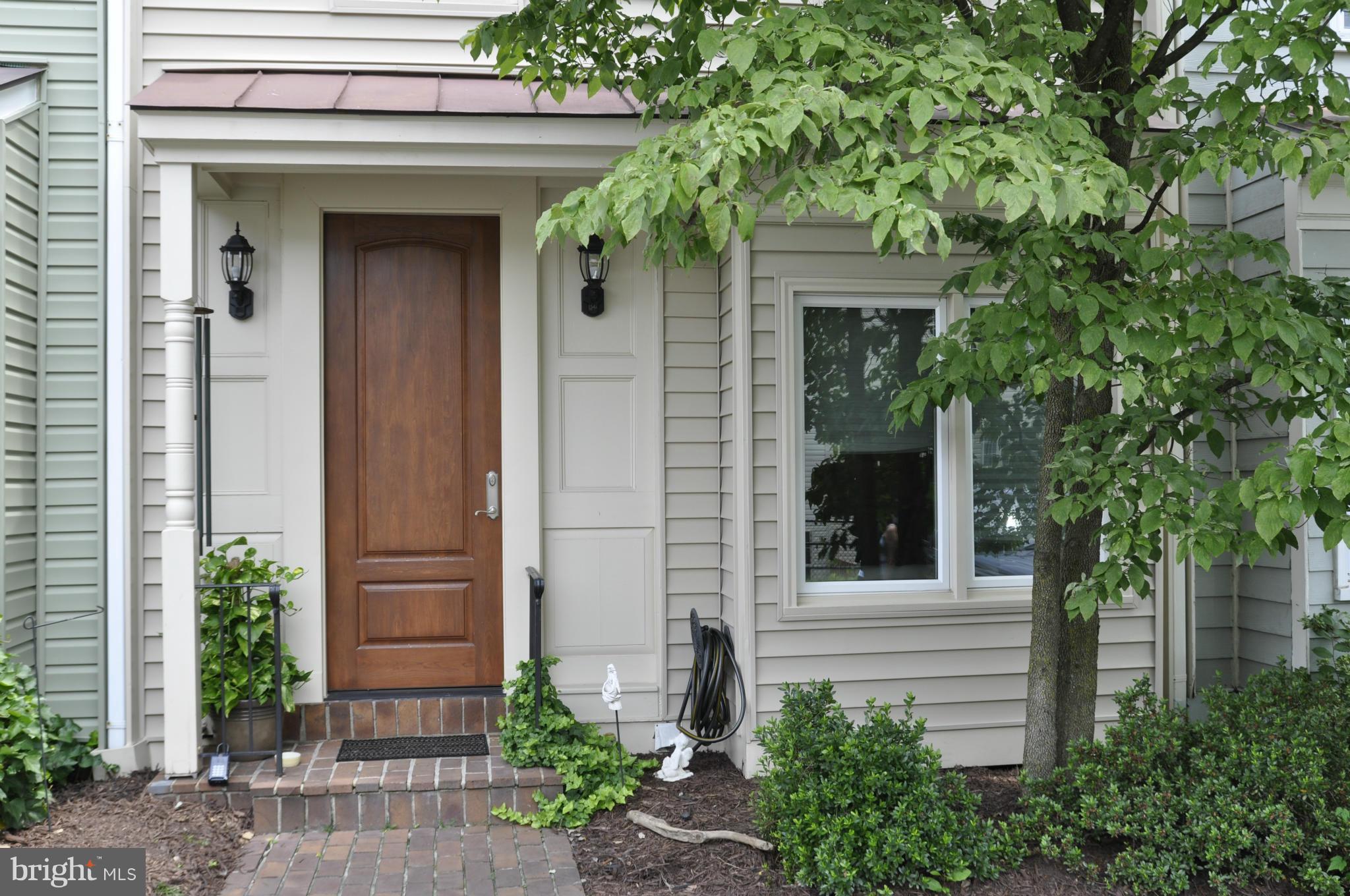 113 River Road Occoquan, VA 22125 - Photo 2 of 18 a front view of a house with plants