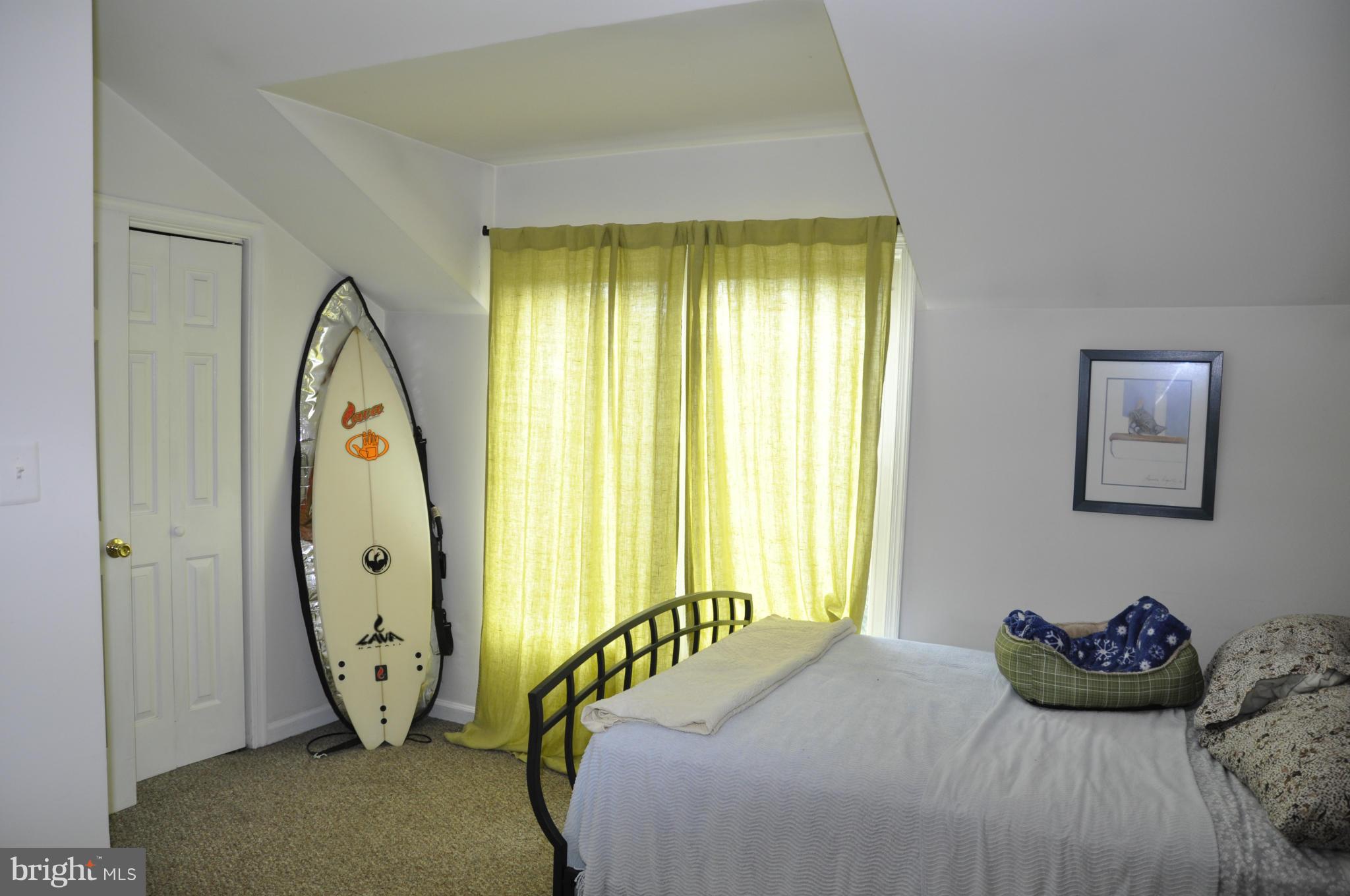 113 River Road Occoquan, VA 22125 - Photo 13 of 18 a bedroom with a bed and a window