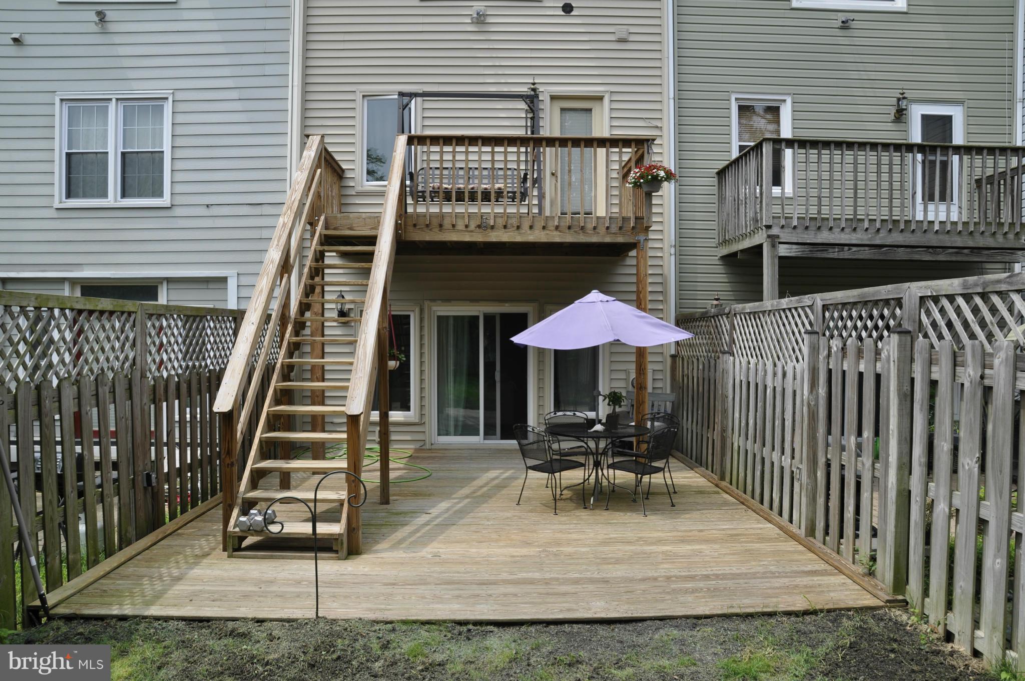113 River Road Occoquan, VA 22125 - Photo 16 of 18 a view of a chairs with barbeque grill and wooden fence