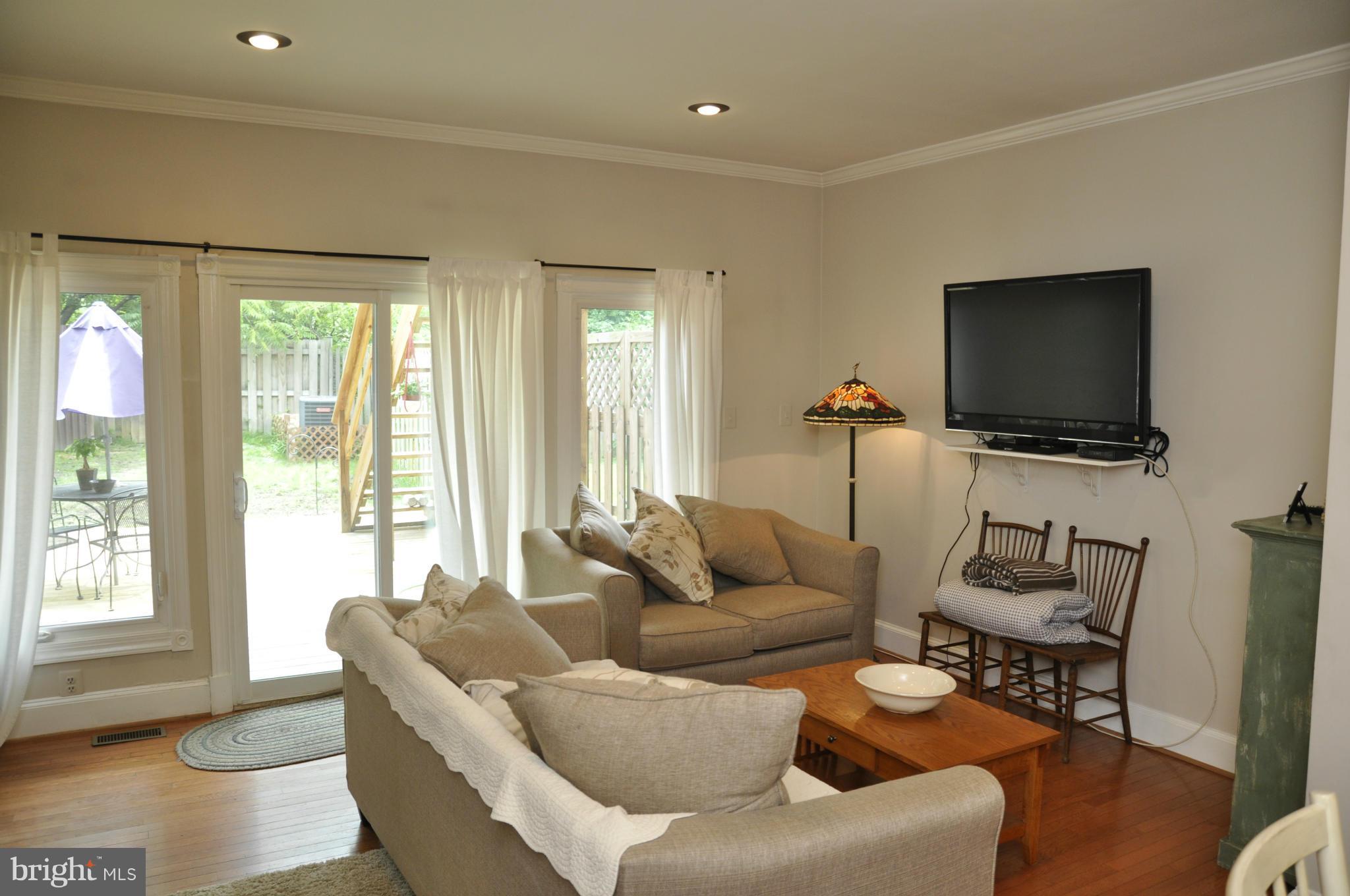 113 River Road Occoquan, VA 22125 - Photo 5 of 18 a living room with furniture and a flat screen tv