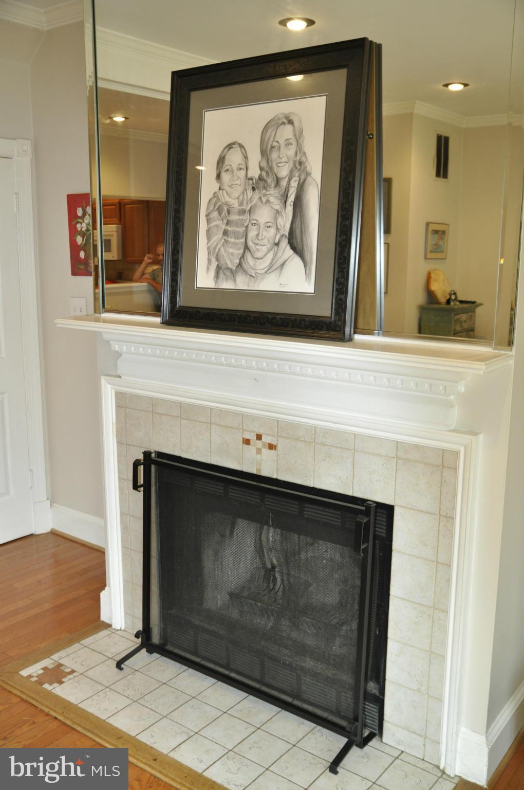 113 River Road Occoquan, VA 22125 - Photo 7 of 18 a fireplace with a painting on the wall