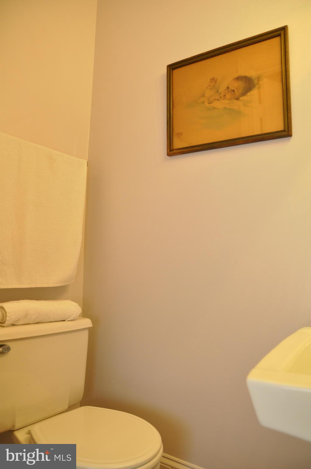 113 River Road Occoquan, VA 22125 - Photo 8 of 18 a white toilet sitting next to a white wall